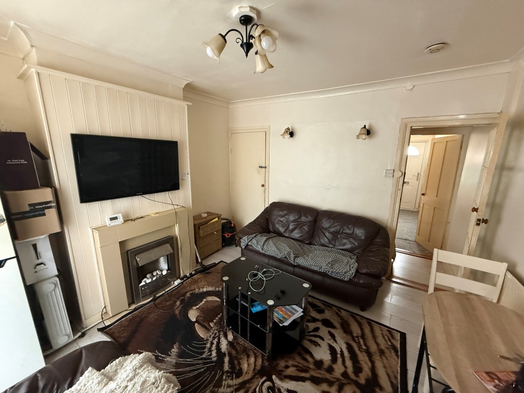Lot: 221 - END-TERRACE HOUSE FOR REPAIR - Dining room with table and sofa